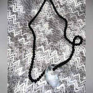 Obsidian crystal necklace with big crystal rock.